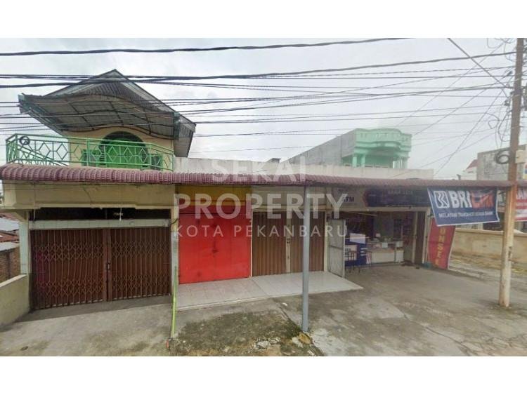 Di jual rumah beserta ruko 2 lantai dan 3 kios 1 lantai lokasi dekat Jalan Sudirman